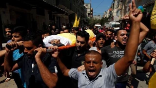 Palestinians hold funeral for man killed during Gaza protest